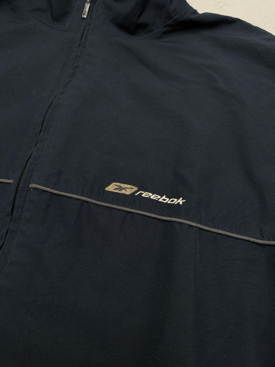 Reebok Jacke navy gold Logo Detail
