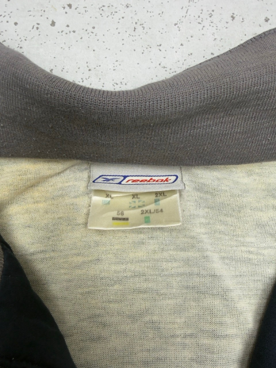 Reebok Jacke navy gold Etikett