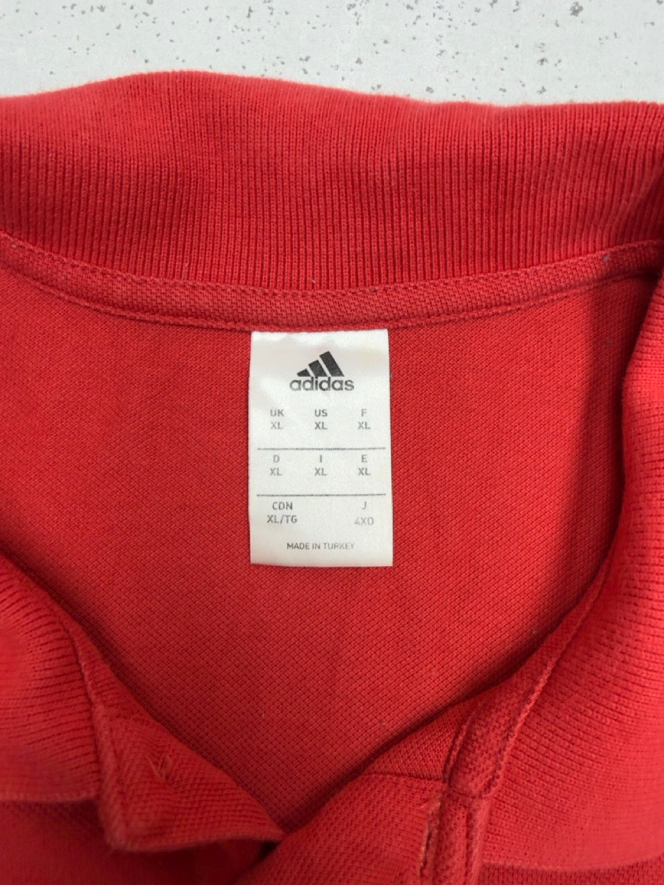 Adidas Manchester United Poloshirt rot Etikett