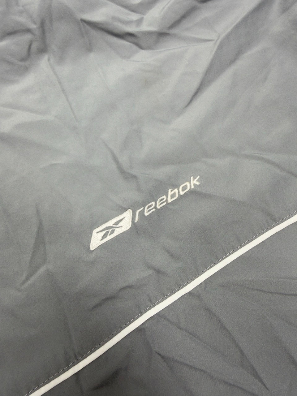 Reebok Trainingsjacke grau blau Rückseite