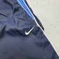 Nike Vintage Trackpants in Navy, Größe M, Swoosh-Logo Nahaufnahme
