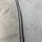Nike Vintage Trackpants in Beige mit Navy Paspel, Größe S, Detail Reißverschluss geöffnet