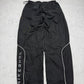 Nike Shox Vintage Trackpants in Schwarz, Größe L, Rückansicht mit NIKESHOX-Schriftzug