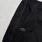 Umbro Vintage Trackpants in Schwarz, Größe L, Detail Zippertasche mit Logo