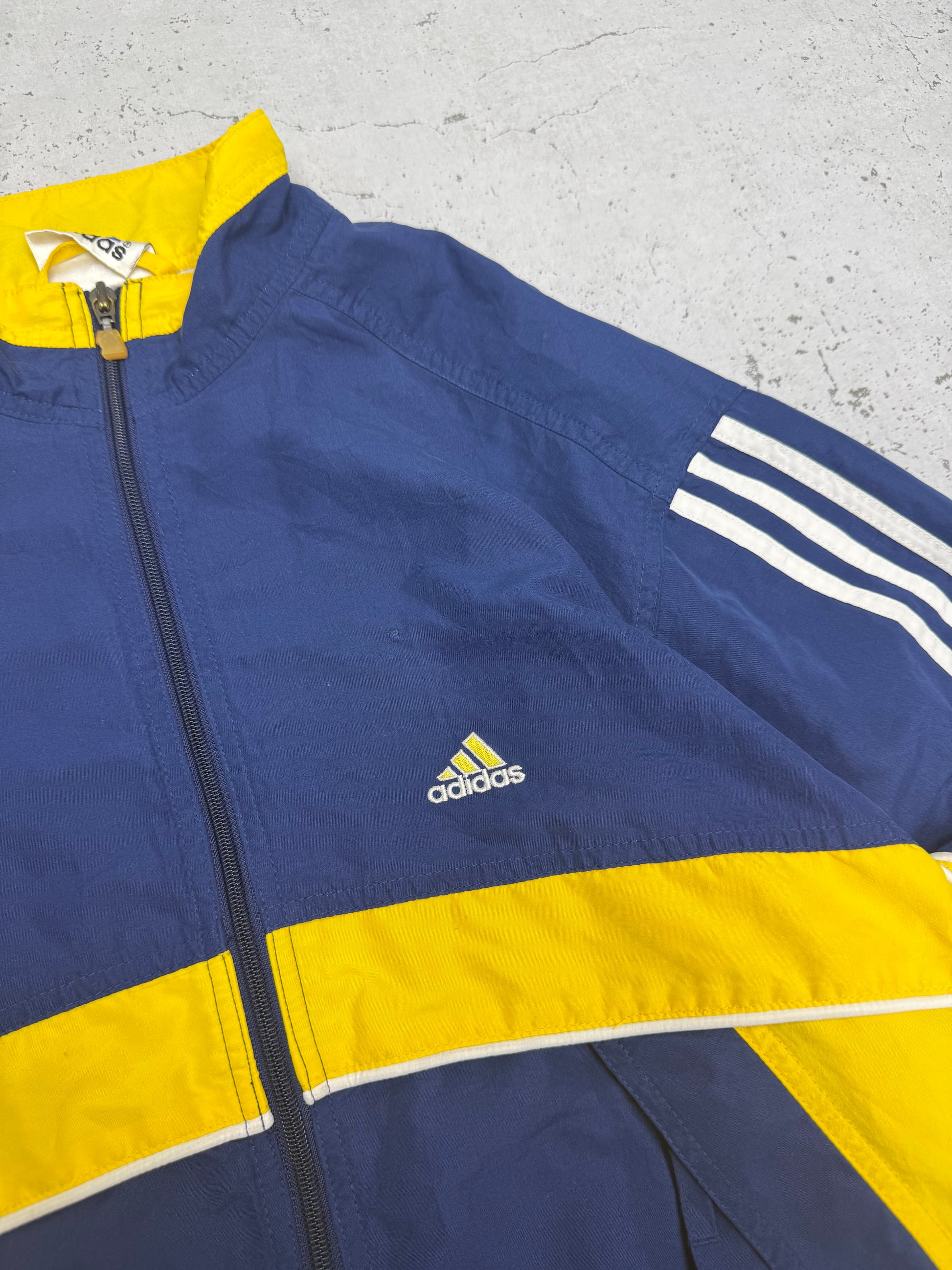 Adidas Vintage Windbreaker in Navy Gelb, Logo-Closeup